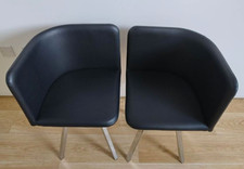 Elsie Dining Chair Featuring Faux Black Leather Seat With A Unique Angled Design