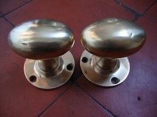 Antique matched pair of oval "Goose Egg " solid brass motice lock door knobs