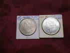 TWO (2) MORGAN SILVER DOLLARS (1) 1898 P & (1) 1900 P NEAR UNCIRCULATED