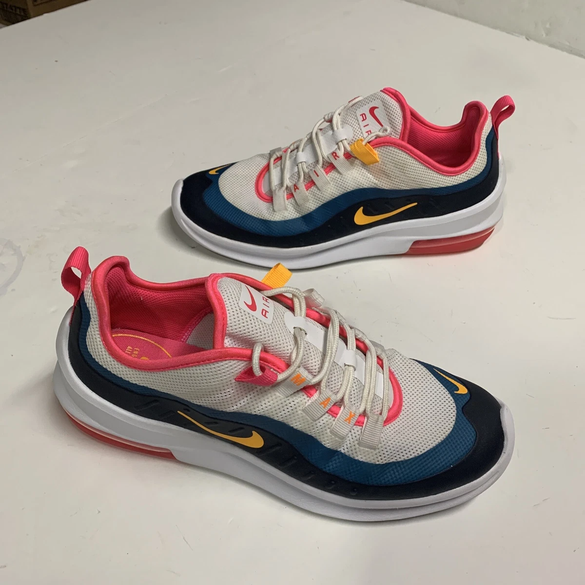 Pink and hotsell navy nike shoes