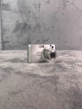 Casio Exilim EX-Z850 8.1MP Digital Camera Silver 3x Zoom Tested Works No Charger