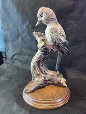Resin woodpecker figurine in tree (27x15cm) on wood base unbranded