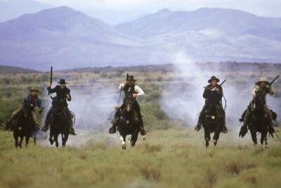 Kurt Russell and Val Kilmer in Tombstone and men fire rifle 16x20 poster