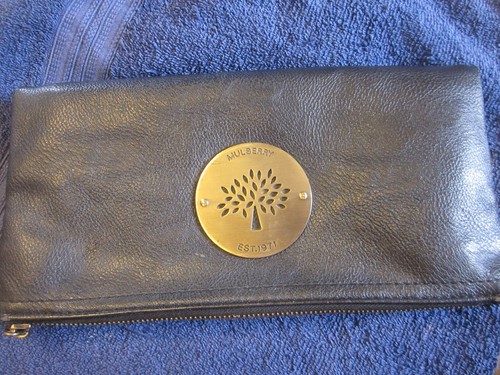 Mulberry fold-over bag. Brass zip pulls & plate. Black. Rubbed on edge