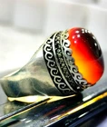 Sterling silver ring set with a light-transmitting Yemeni agate (liver-colored).