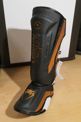 Venum Elite Evo Schienbeinschoner - Schwarz/Bronze - L