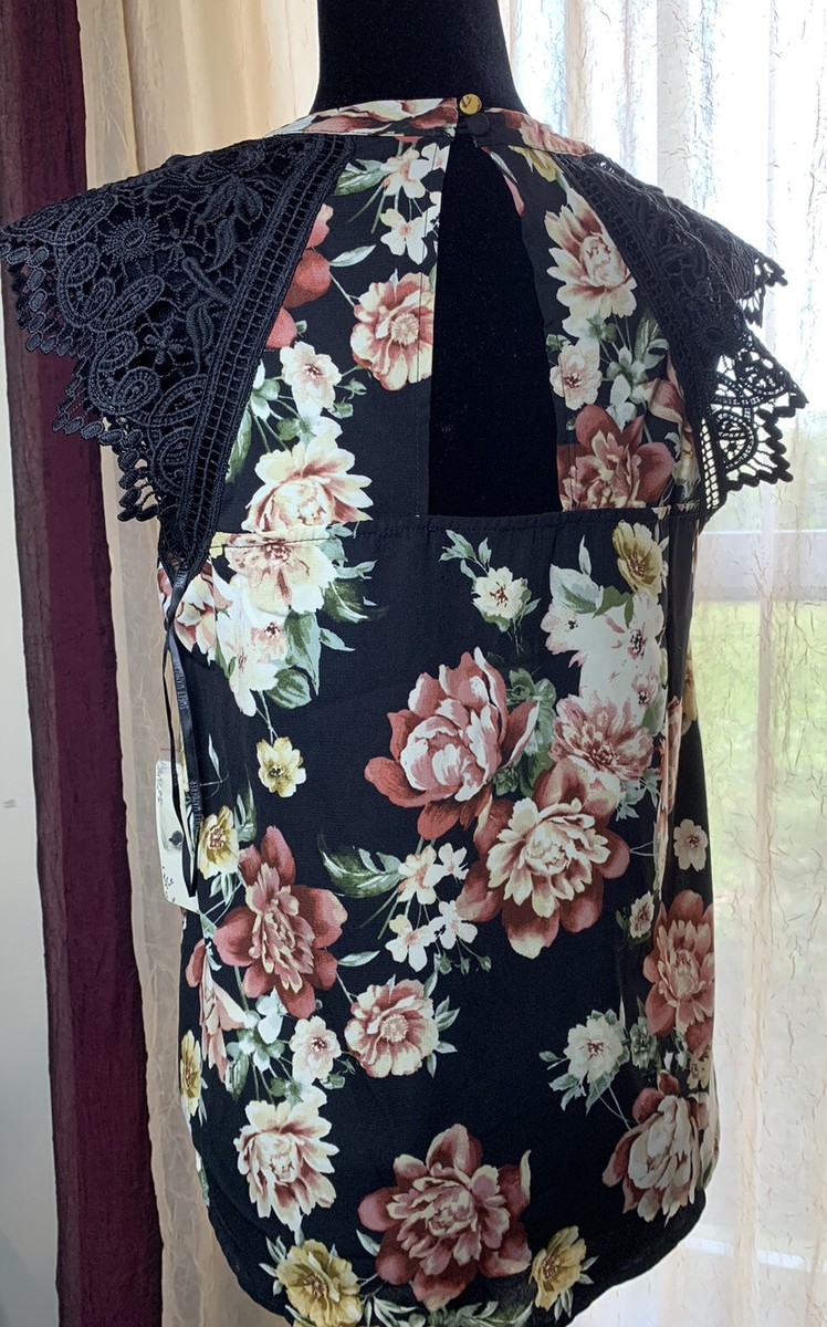 The Sweet Wanderer Women's Sleeveless Blouse is a stylish and