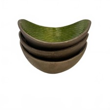 Set of three MCM decorative bowls with textured green interiors.