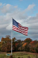 Photo:gigantic American flag, erected Alliance Rubber Company, maker rub