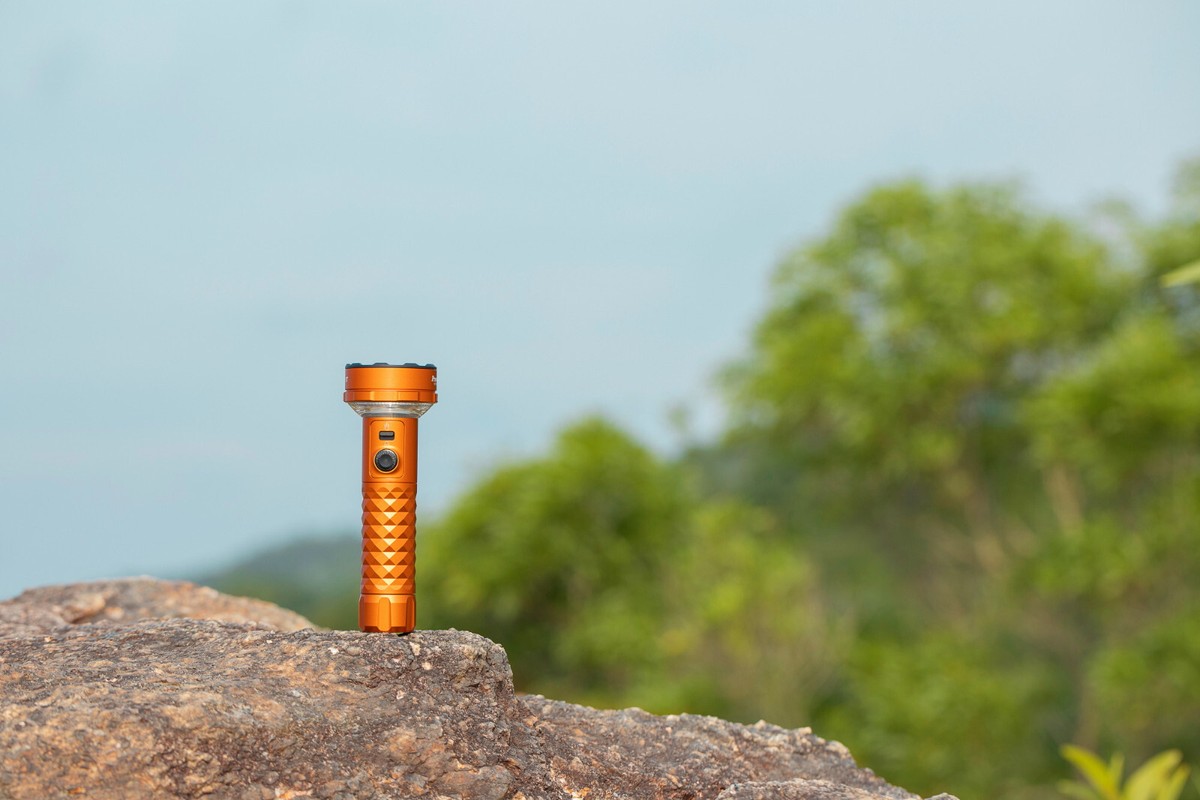 Olight Prowess Orange Flashlight/Cozy Lamp, 5000 Lumen, Forward