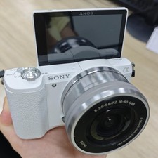 Sony Alpha a5100 24.3MP Mirrorless w/16-50mm Lens Digital Camera White English