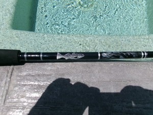 New, custom built, 7'2", 20-30 lb. spinning rod w/hand-woven Striped bass