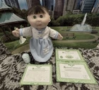 1991 Mattel first edition cabbage patch baby with bottle and birth certificate.