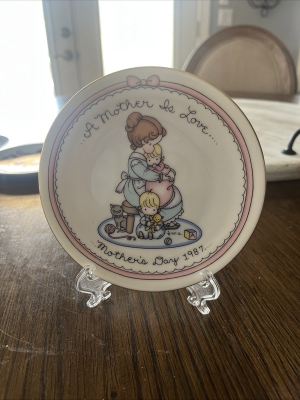 1987 Joan Walsh Anglund  plate A Mother Is Love Mother's Day Avon Small plate.