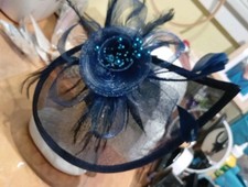 A Lovely Navy Blue Fascinator with A Stunning Mesh Panel and Feathers With Beads