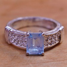 Size 8.25, vintage Sterling 925 silver engagement ring with blue topaz and cz