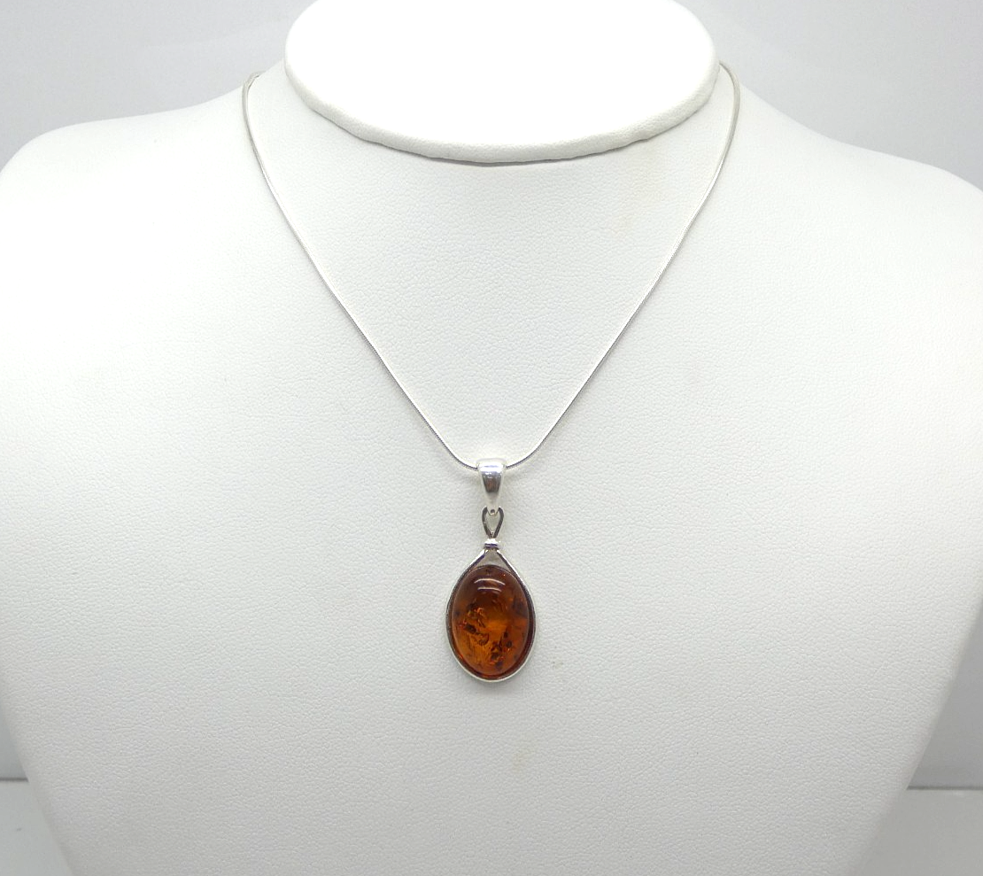Tear Drop Shaped Natural Amber Necklace in Sterling Silver Frame