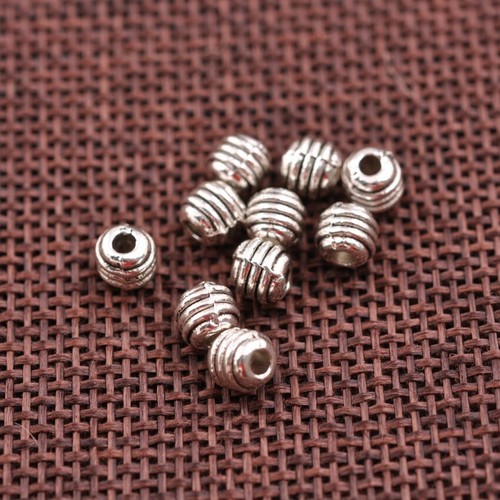 100 piezas dijes redondos de plata tibetana espaciador hallazgos de joyería 5*4,5 mm A3042 - Imagen 2 de 7