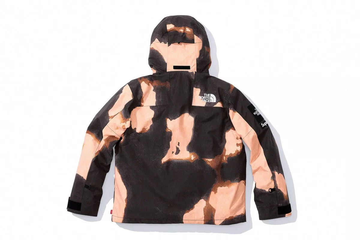 Supreme®/The North Face® Bleached Denim Print Mountain Jacket with stiker