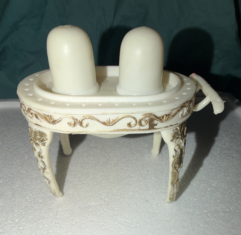 Vintage salt and pepper shakers with sugar stand. ￼