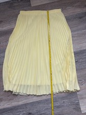 Women's yellow pleated long pull on lined skirt