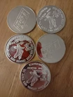 five 1 troy ounce .999 fine silver rounds Tri state mint. •	Eagle & Shield