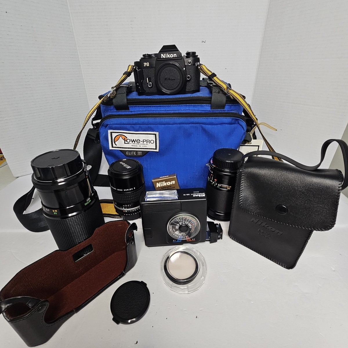 Nikon FG-20 35mm Camera W/ 70 210 mm Lens, 28 85 mm, A1 S 135