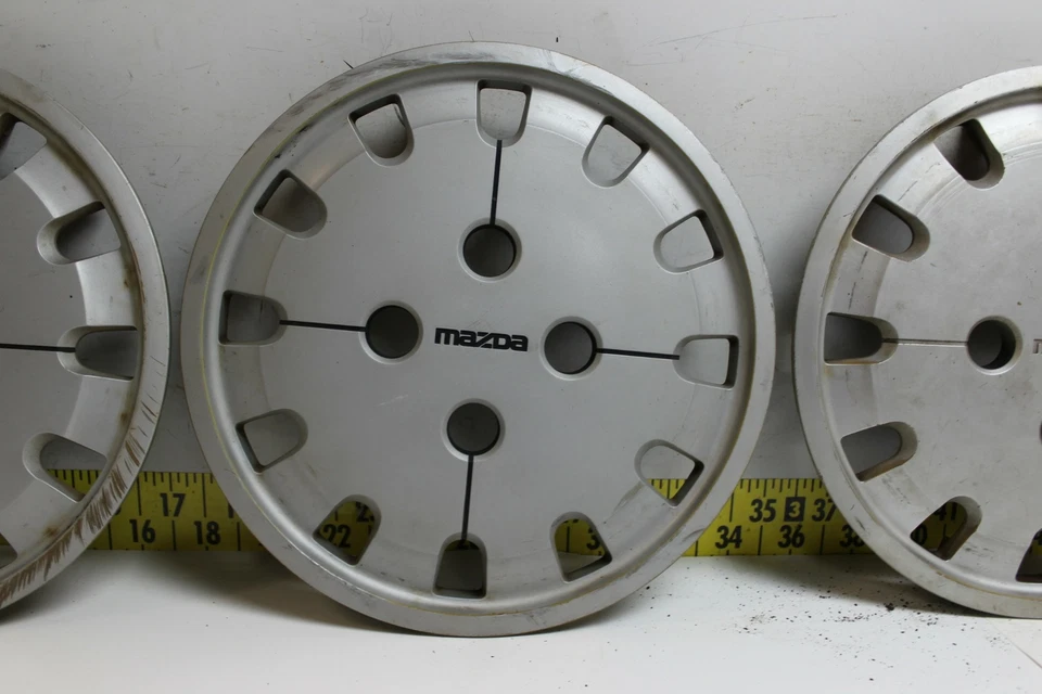 Juego de 4 tapacubos usados OEM G12037170 1986-1987 Mazda 626 363 (3345) Foto 3 de 4