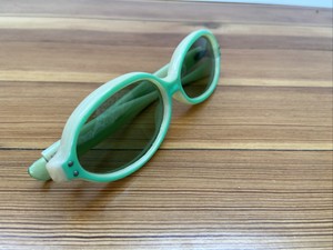 green oval sunglasses