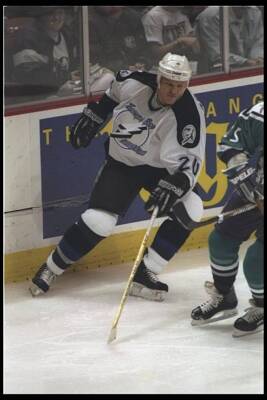 Defenseman Rudy Poeschek Tampa Bay Lightning moves down the ice th- Old Photo