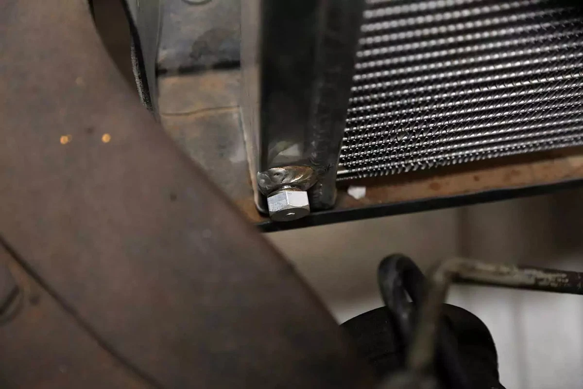 Drain port location at the bottom of the radiator.