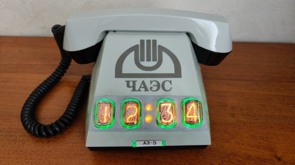 Styled as a literal Chernobyl reactor control-room hotline phone with Nixie tube readout — this is the most unhinged, gloriously specific desk object on the internet.