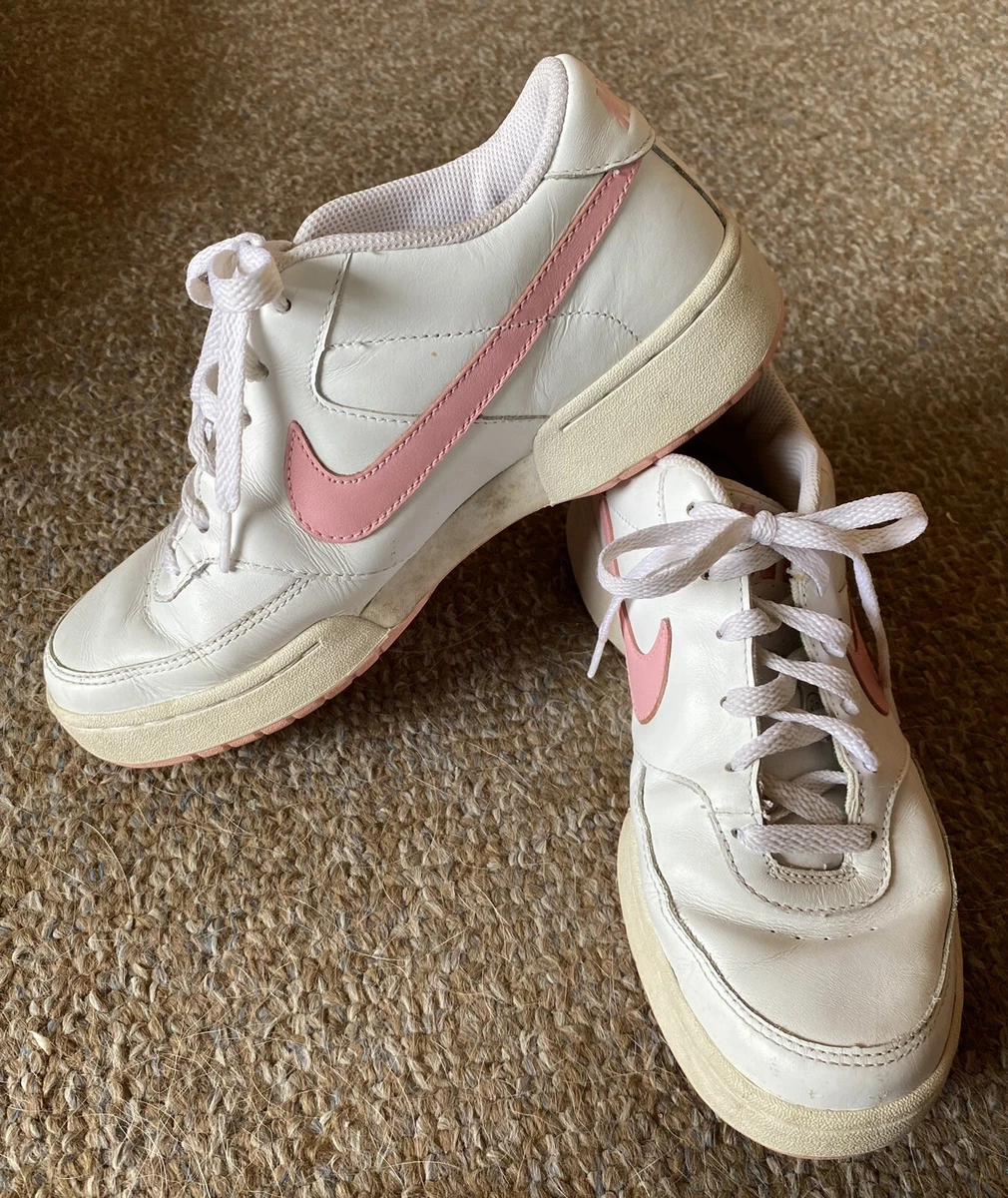 Nike pink swoosh sales shoes