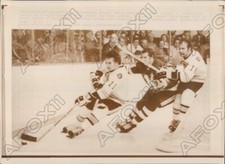 1975 Boston Bruin Andre Savard vs Minnesota North Star Tom Reid Press Photo