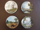 POOLE POTTERY JOHN CONSTABLE AND JACOB VAN RUISDAEL FOUR DECORATIVE PLATES
