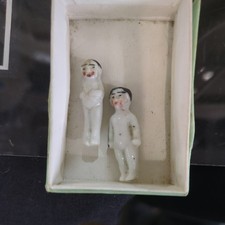 TWO ANTIQUE MINIATURE PORCELAIN FROZEN CHARLOTTE DOLLS