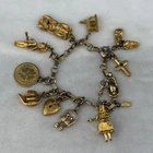 Vintage Monet Charm Bracelet Gold Tone Doll Cross Baby Shoes Birds Heart Luck 7"