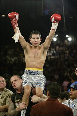 Marco Antonio Barrera celebrates his victory over Erik Morales dur- Old Photo