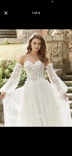 New white wedding dress. Size 12 with adjustable corset. Veil included, no cost