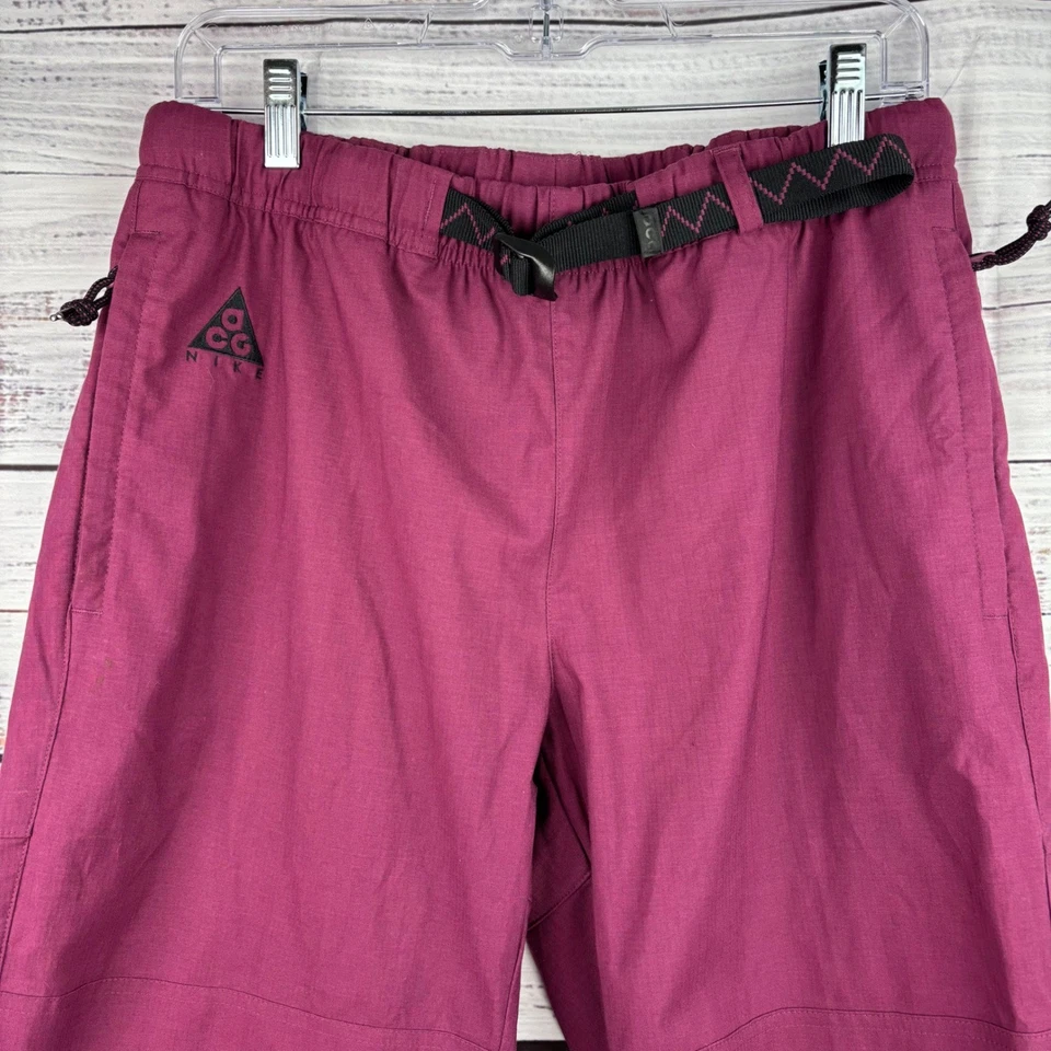 Pantalones de Senderismo Nike ACG Tejidos Trail Medianos Calientes Rosa Cinturón Ligeros Exterior Foto 2 de 4