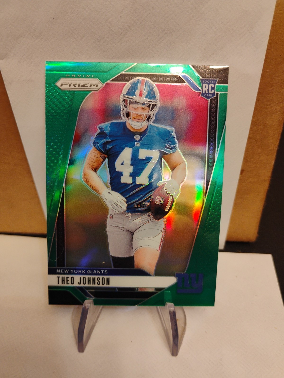 2024 Panini Prizm - Rookies Theo Johnson #390 Green Prizm (RC)