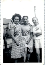 1940s Friends Smiling Outdoors Man Wearing Apron Skirt In Yard Vintage Photo