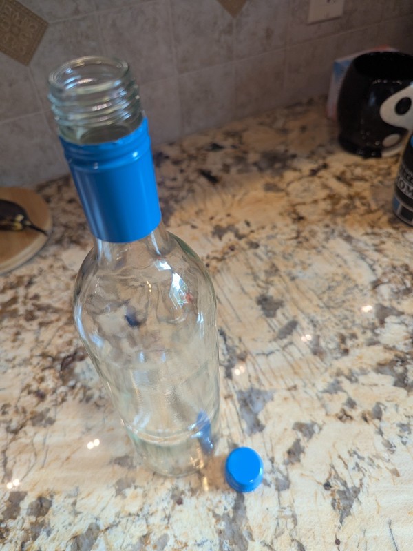 Wine Bottle With Blue Cap