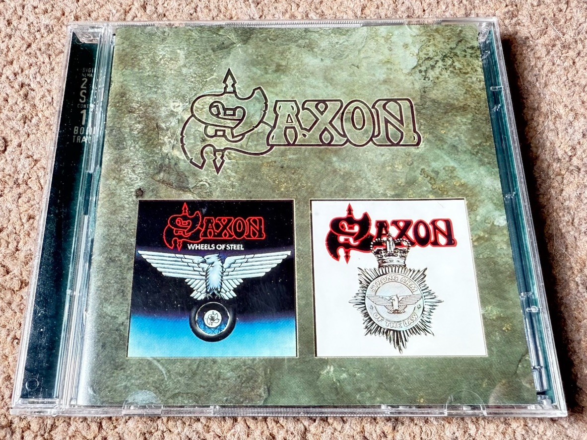 Saxon - Wheels of Steel/Strong Arm of the Law (1997) for