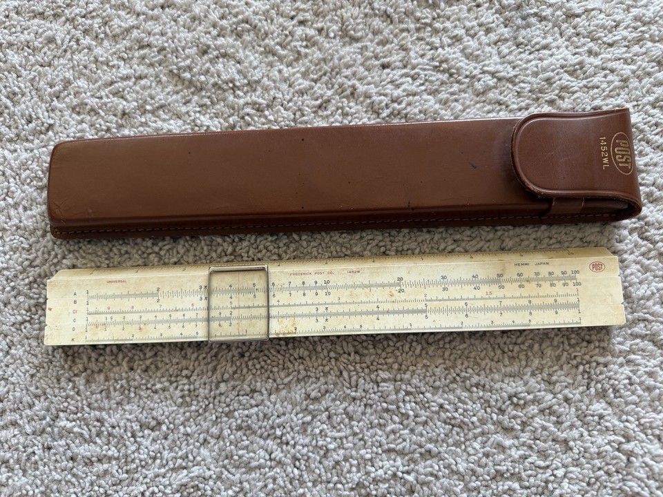 A beautifully crafted Frederick Post/Hemmi Japanese slide rule with original leather case — pre-calculator computing in its most elegant physical form.
