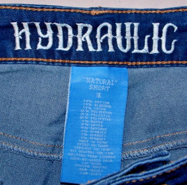 Pantalones cortos hidráulicos de jean para mujer 16 apliques de girasol lavado ligero flor de plástico Foto 2 de 4