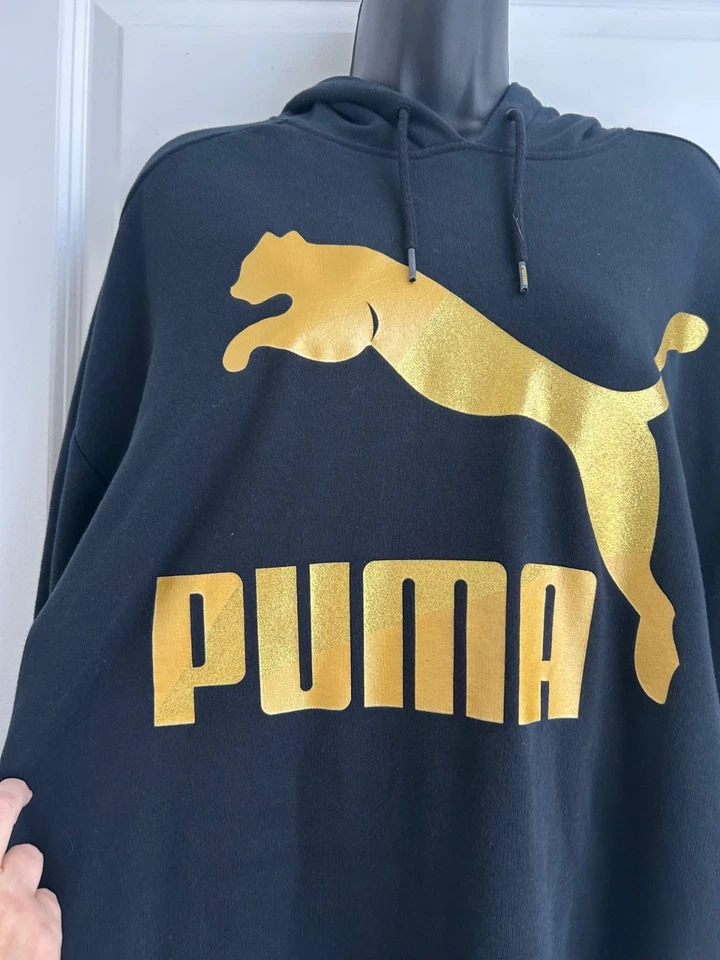 VESTIDO CON CAPUCHA PUMA GLAM OVERSIZE XL Negro con Logo Metálico Dorado Deportivo Informal Foto 4 de 4