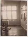 Empty Hospital Treatment Room With Examination Table And Equipment Vintage Photo