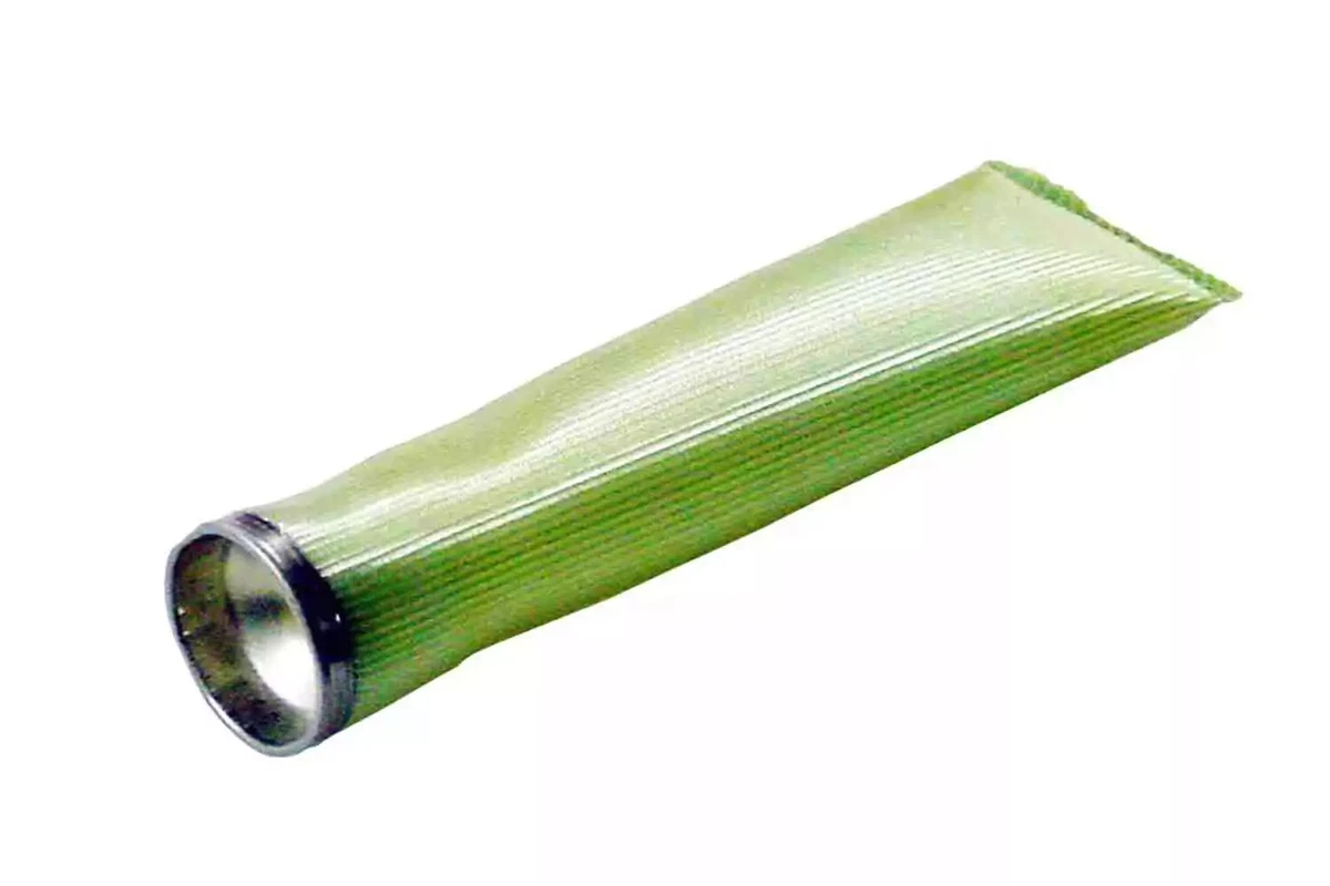 A green vintage General Motors fuel pump sending unit sock filter, displayed on a white background.