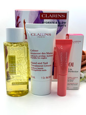 CLARINS Travel Deluxe 3 Piece Set LIP PERFECTOR/HAND CREAM/HYDRATING TONER NIB